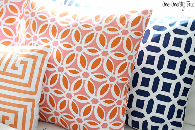 coral orange and navy pillows