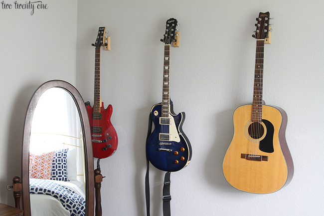 hanging guitars on a wall