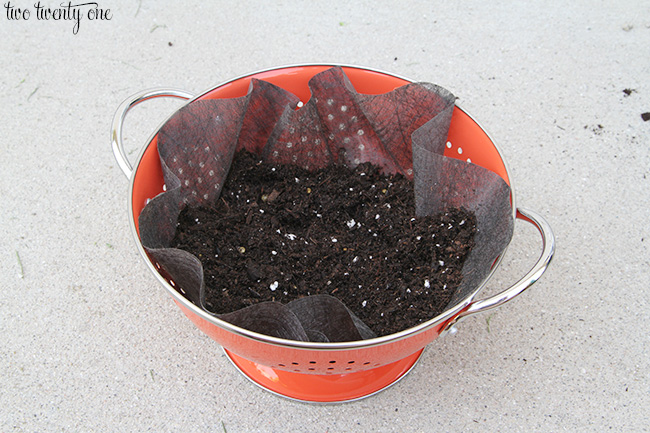 making a colander flower planter