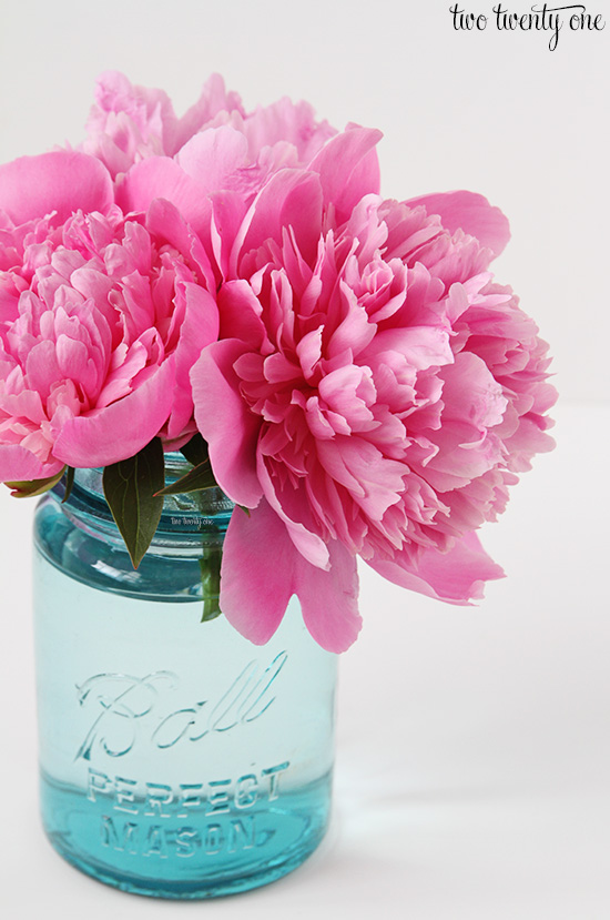 pink peonies in blue mason jar