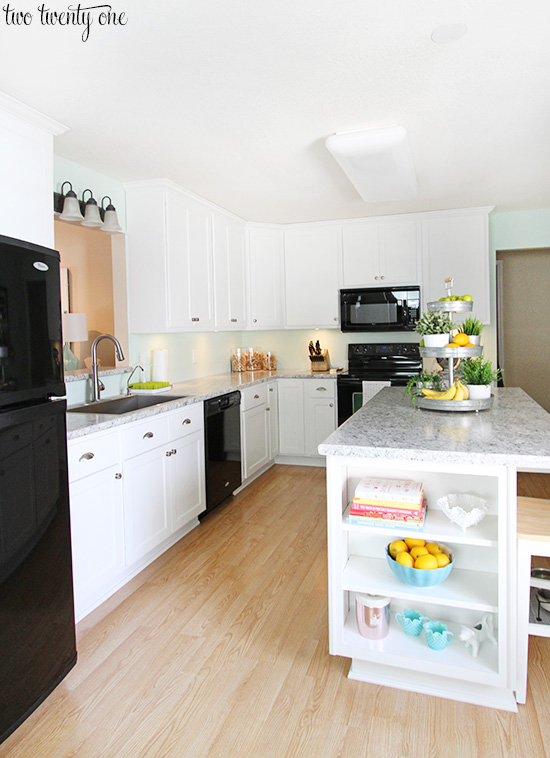 white kitchen black appliances