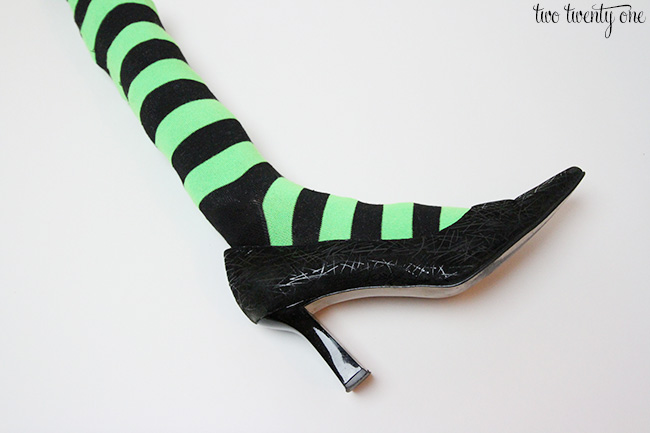 stuffed witch sock in black high heel shoe