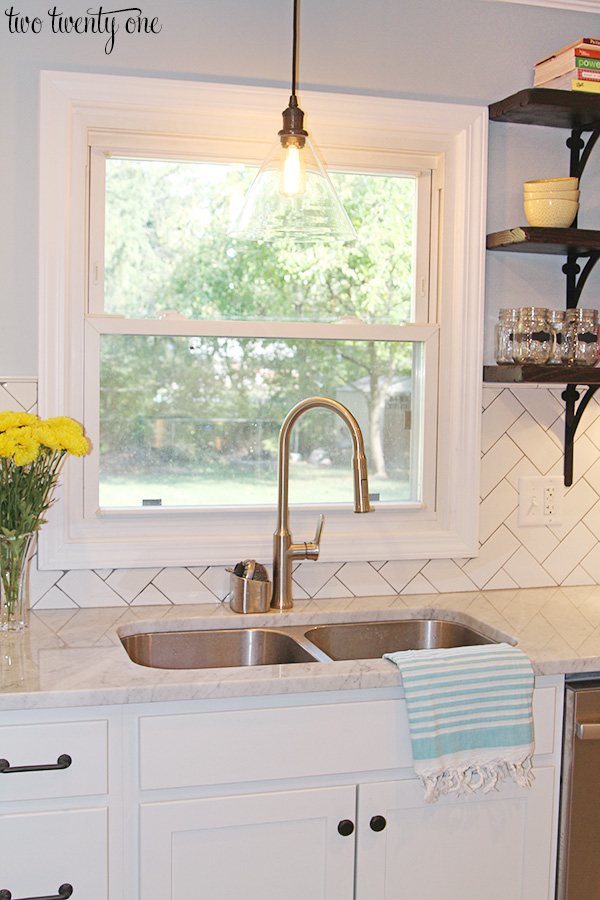 white kitchen with marble countertops