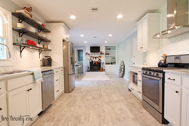 white kitchen with sitting area