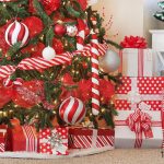 Beautifully decorated red and white Christmas tree with candy cane accents!