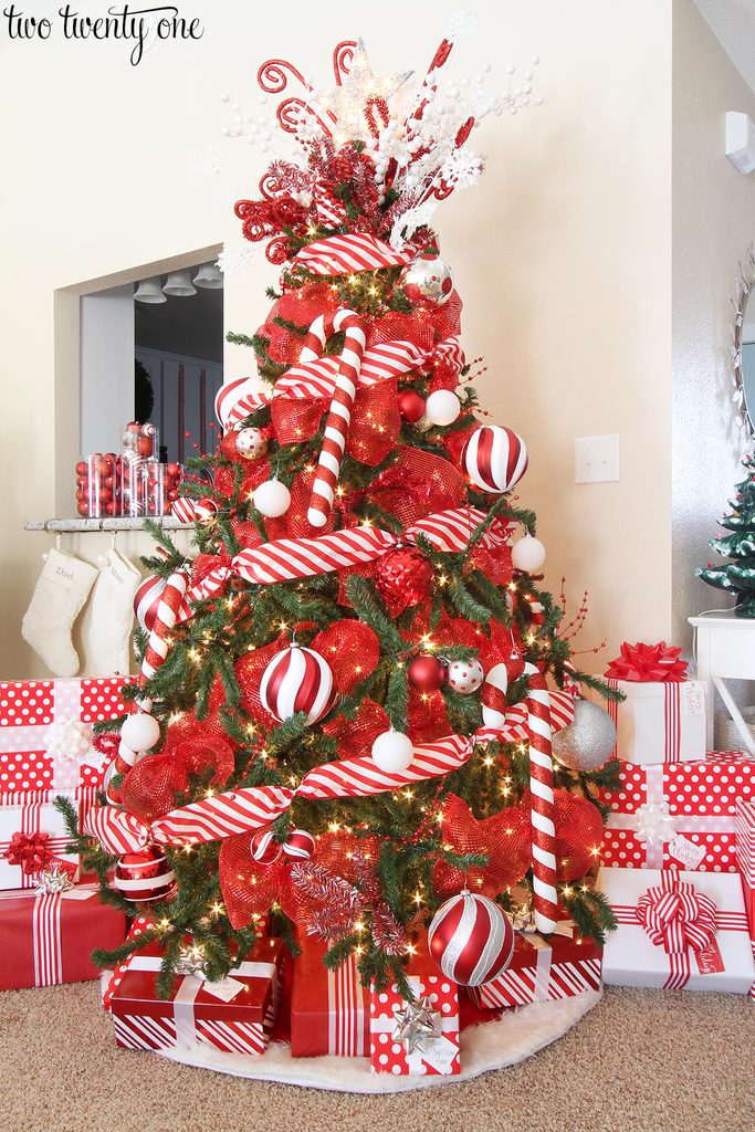 Beautifully decorated red and white Christmas tree with candy cane accents!