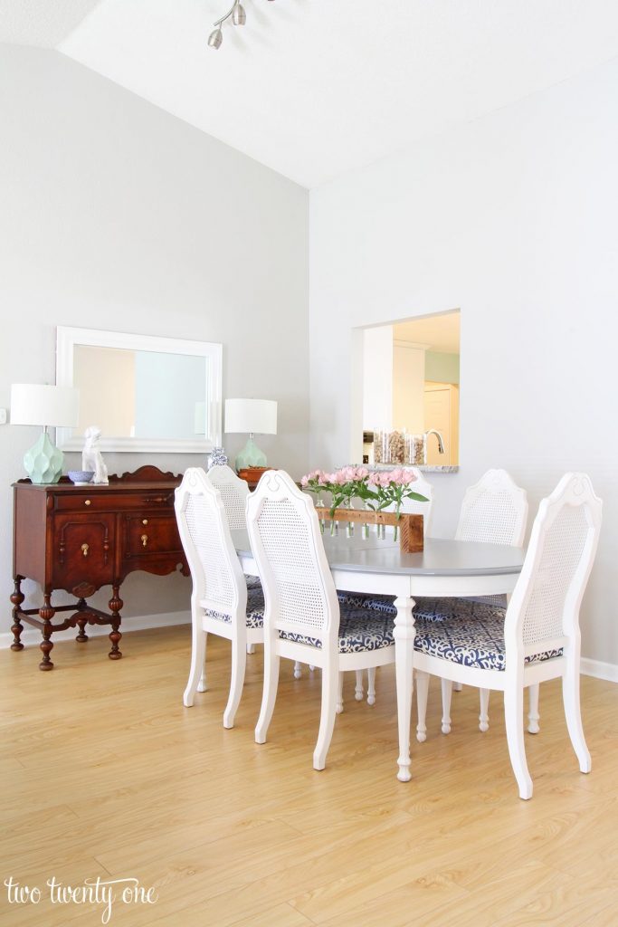 Dining area with Repose Gray on the walls. Six seat dining table. Antique buffet.