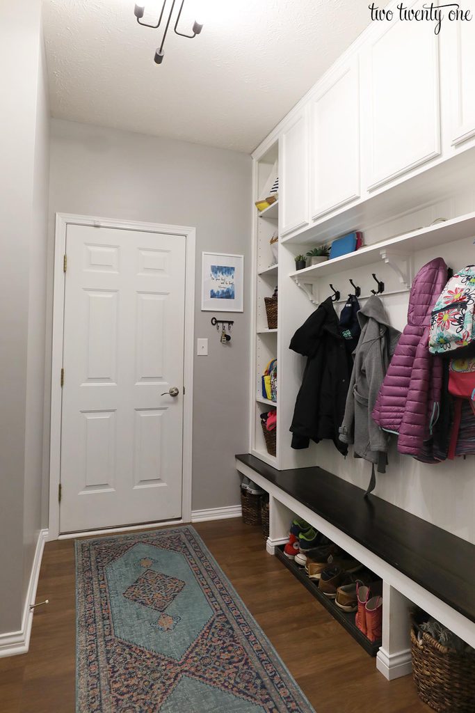 mudroom with white door