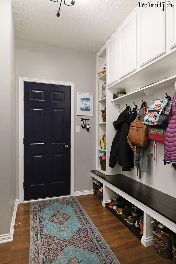 mudroom with blue door