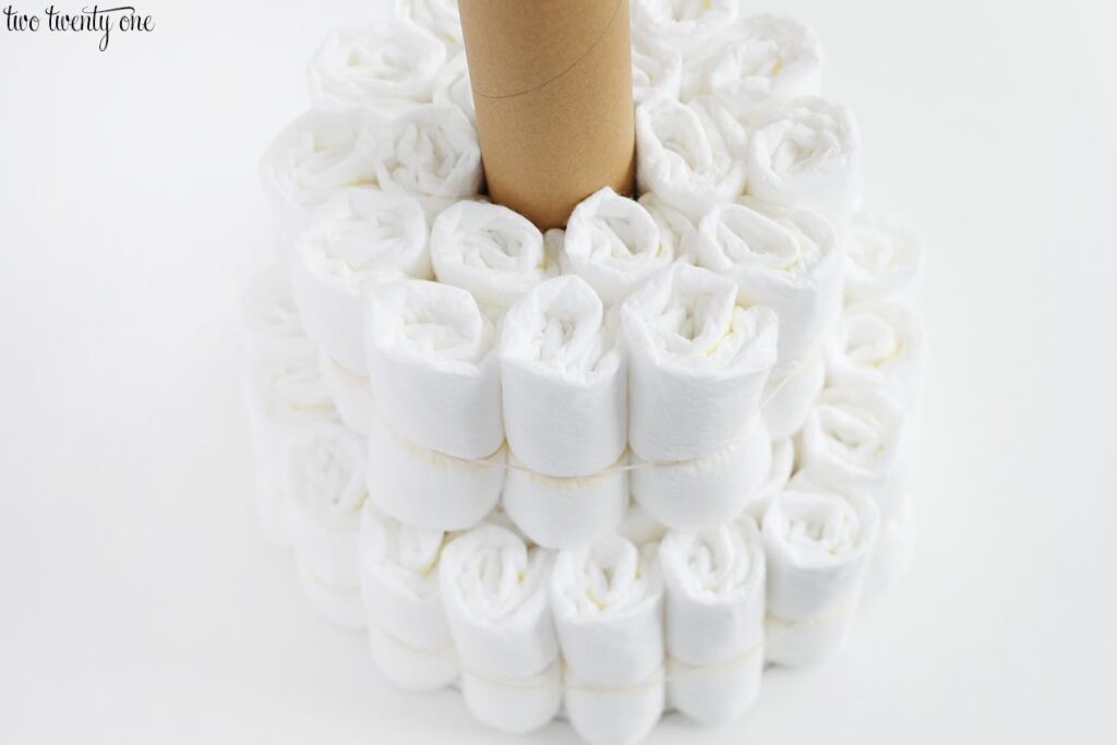 rolled diapers surrounding a cardboard tube