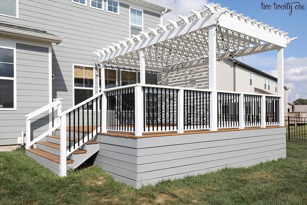 deck with gray base and white pergola