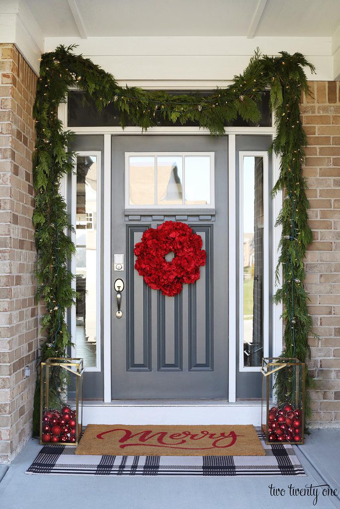 front door decorated for Christmas with garland