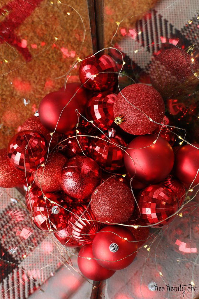 red ornaments with fairy lights