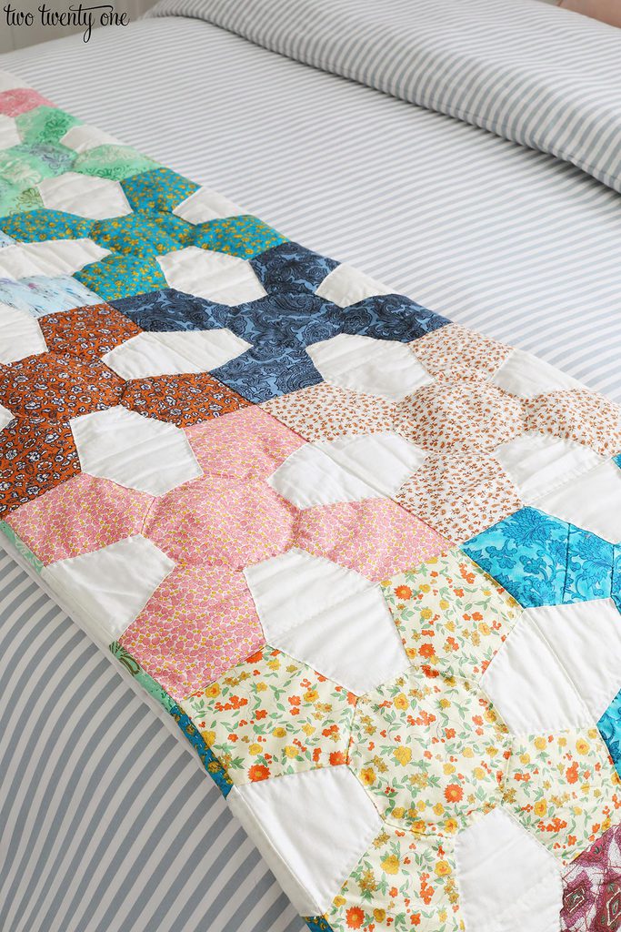 vintage quilt with many colors and patterns