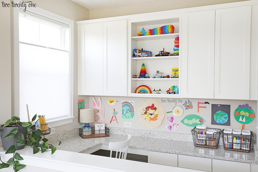 Homework area with wall cabinets and a built-in desk area.