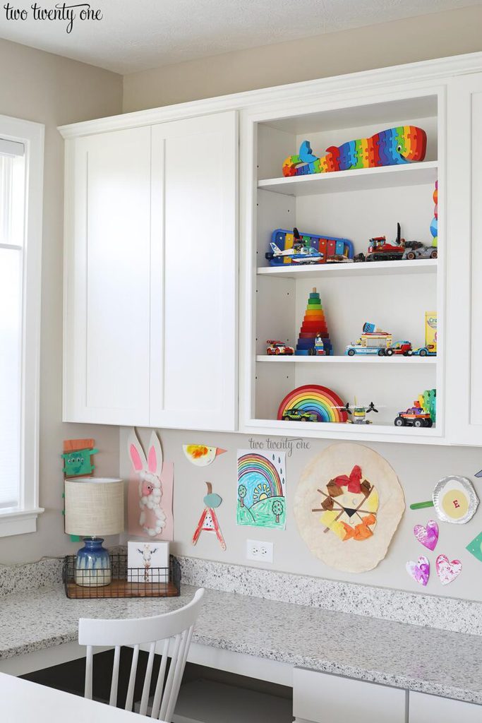 Homework area with wall cabinets and a built-in desk area.