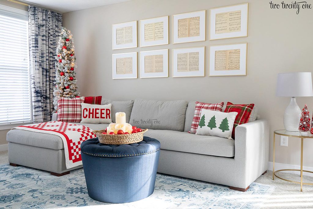 living room decorated for christmas with reds and plaids