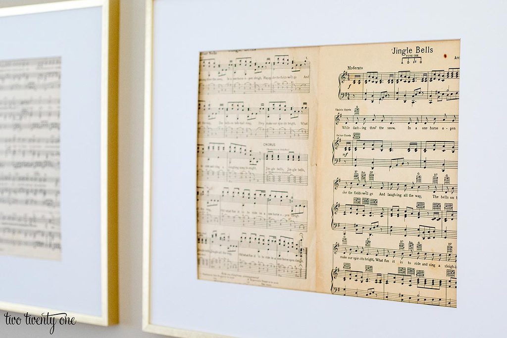 christmas sheet music in a brass picture frame