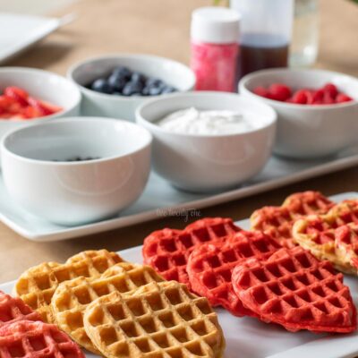 heart shaped waffles on a white platter for Valentine's Day brunch