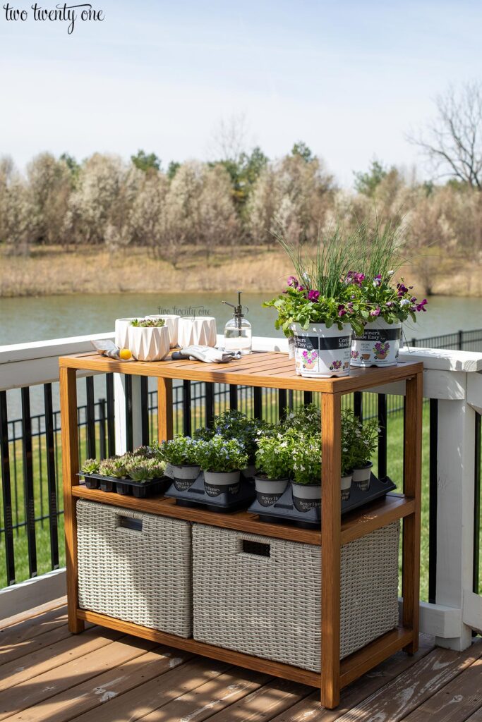 outdoor console table / potting bench with plants on the shelves