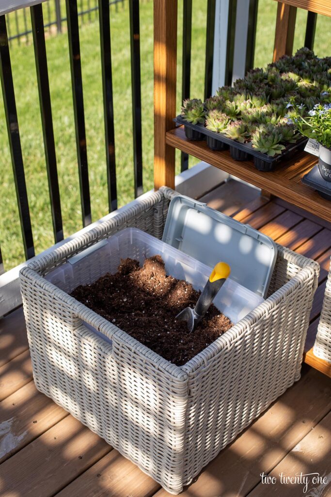storing potting soil in potting bench basket