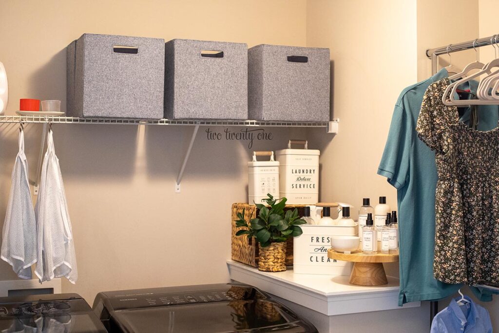 denim blue bins on a wire shelf in a laundry room