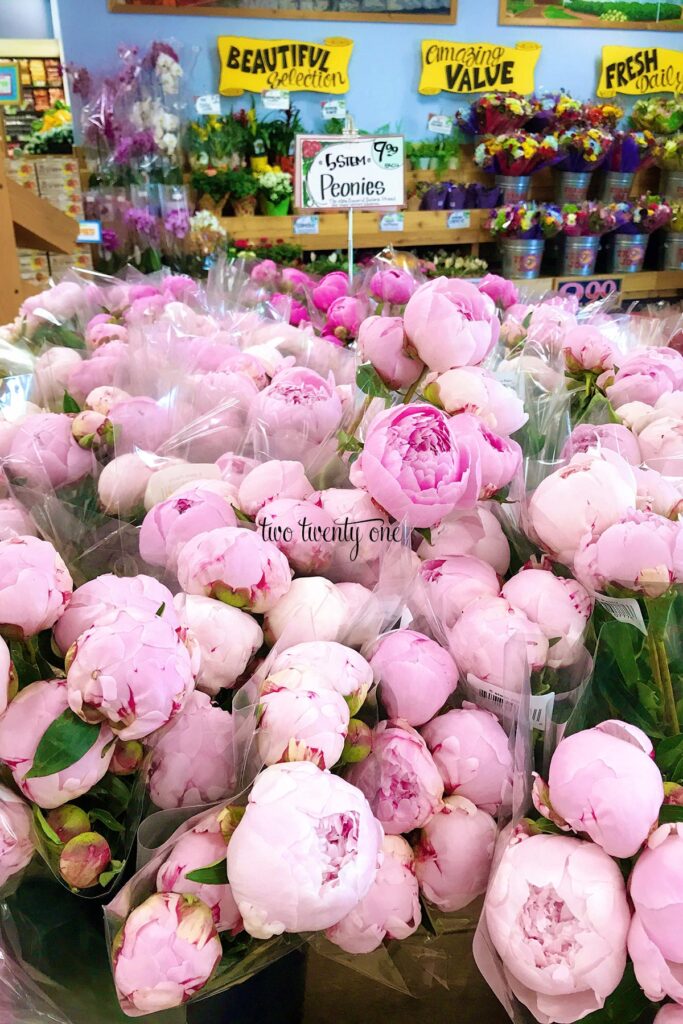 Light pink peonies are displayed for sale at Trader Joe's