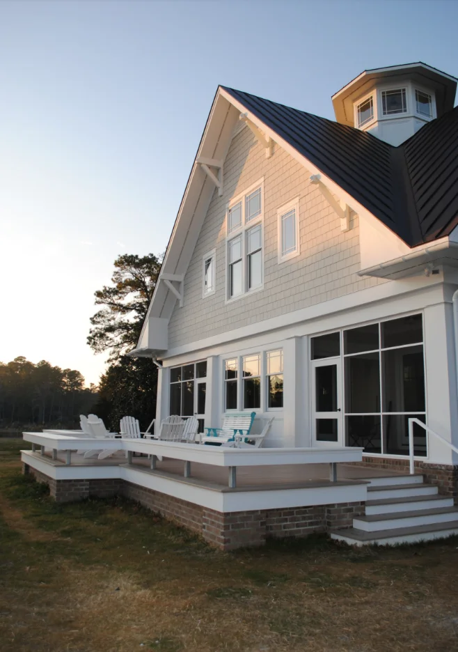 White deck with brick skirting