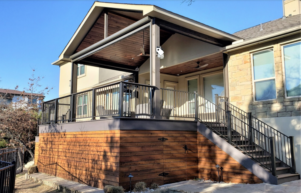 Roofed deck with horizontal wood slat deck skirting